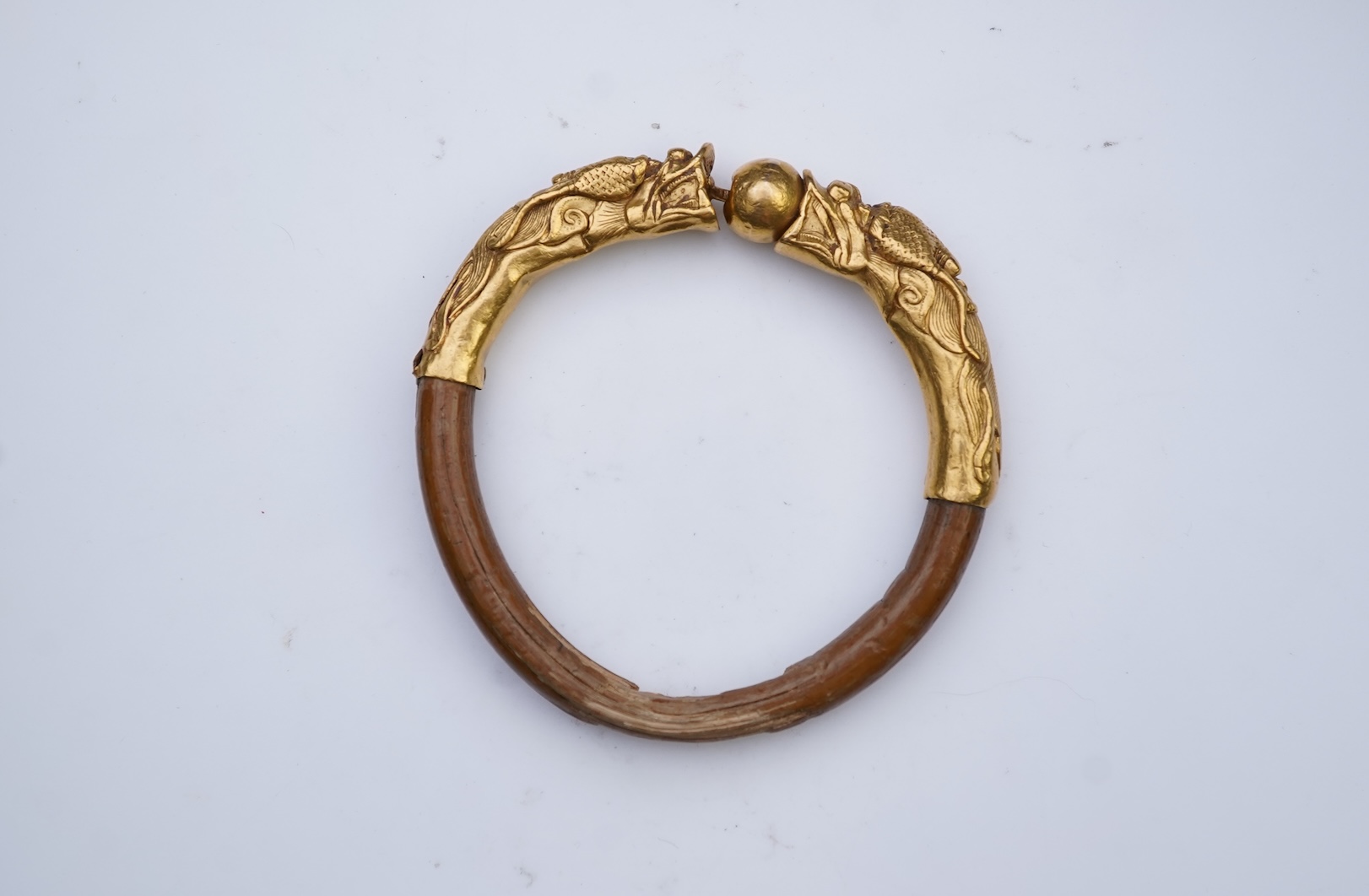 A gold and wood bangle, China, late 19th/early 20th century